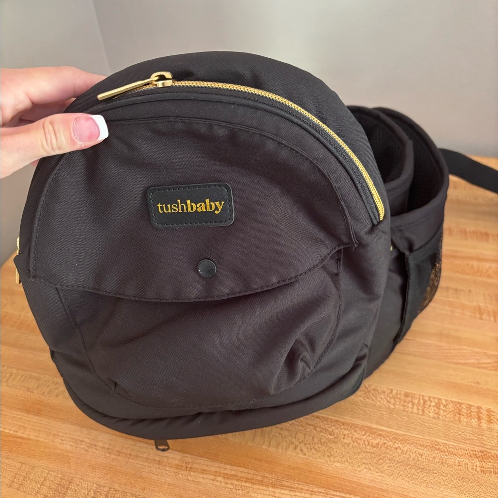 Tushbaby Black Kids Backpack with Gold Accents Baby/toddler carrier